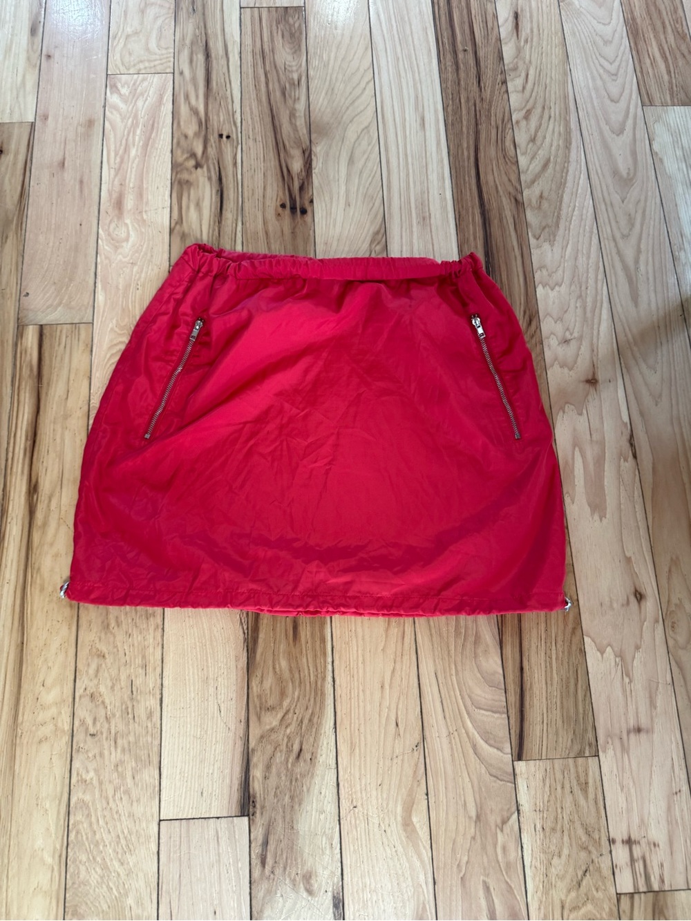 Fashion Nova red nylon mini skirt size small with sporty streetwear vibe.